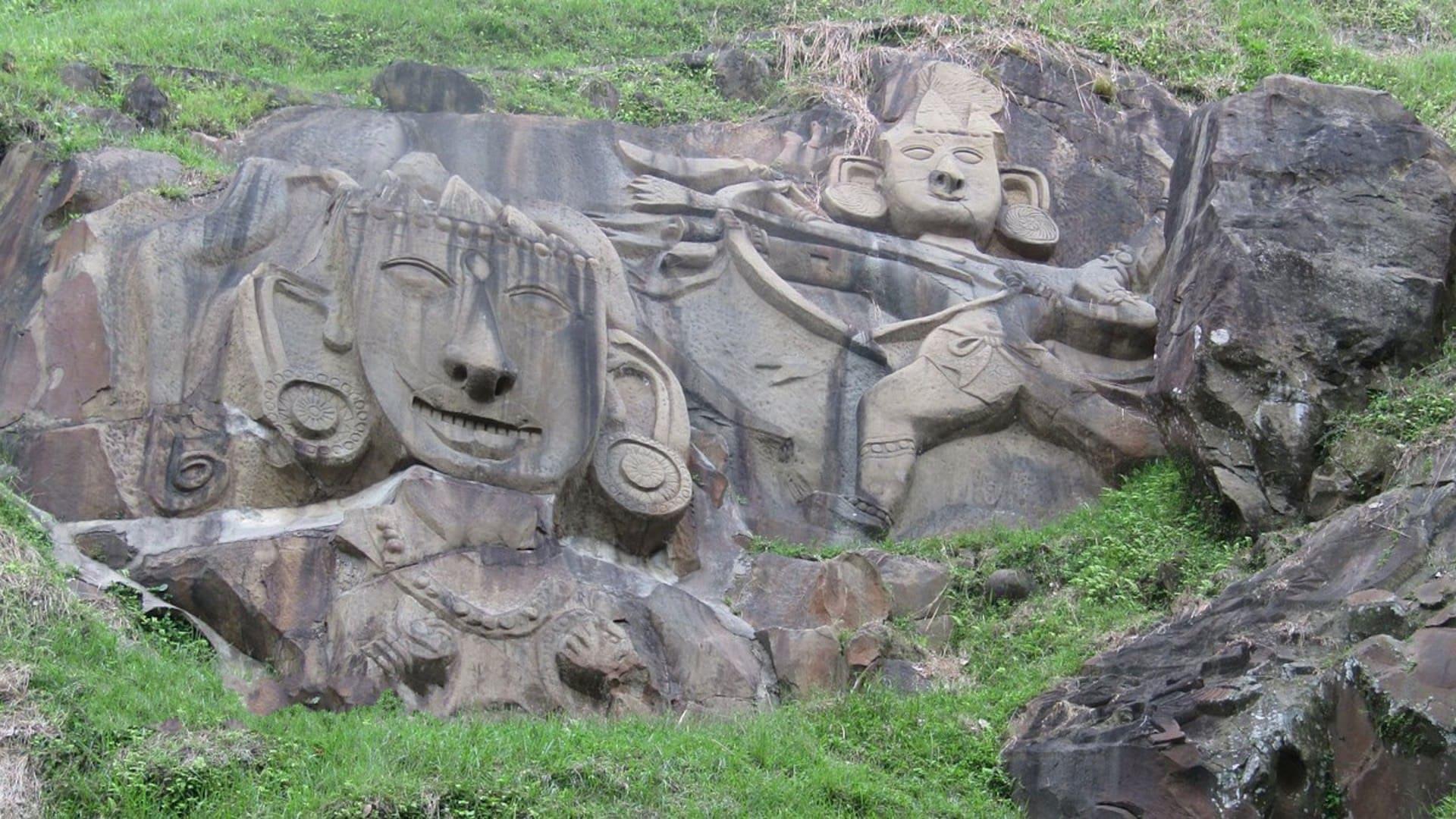 Colossal rock-cut Hindu deities carved into the hillside at Unakoti, Tripura