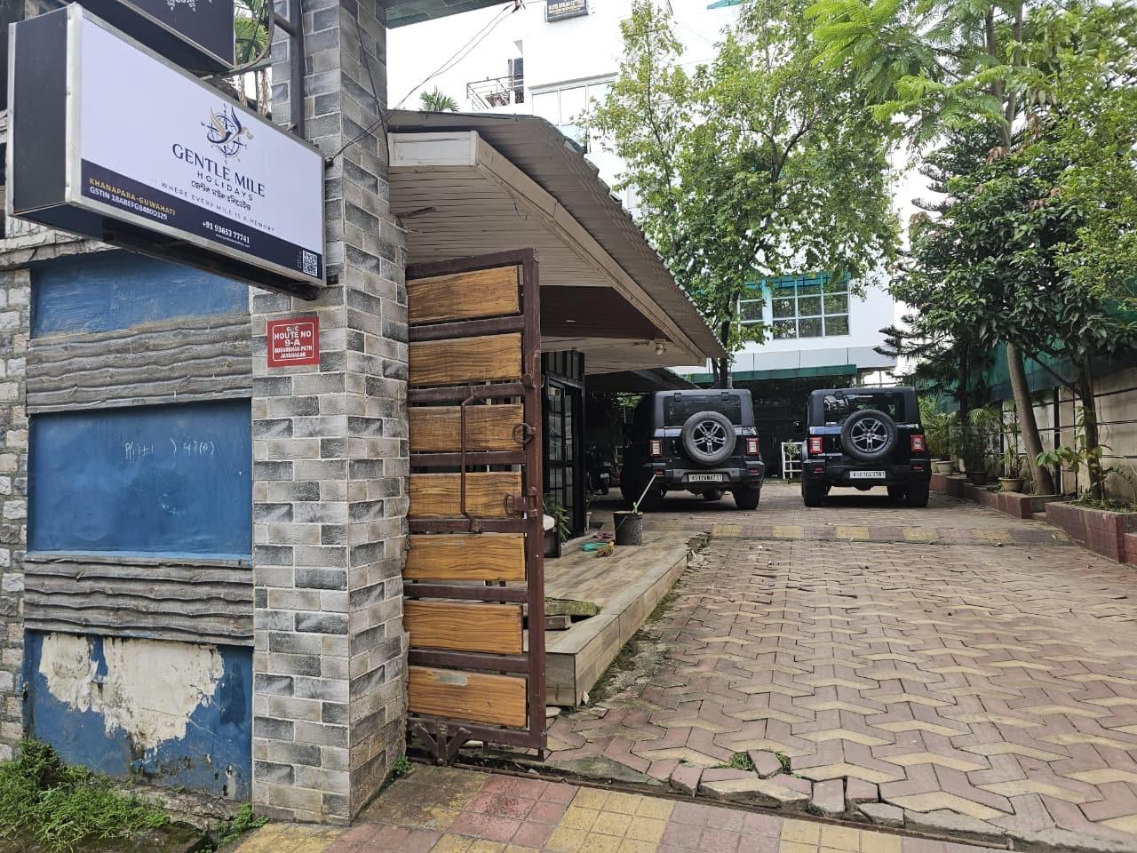 The Gentle Mile Holidays signboard and gate on Suderashan Public School Road, Khanapara
